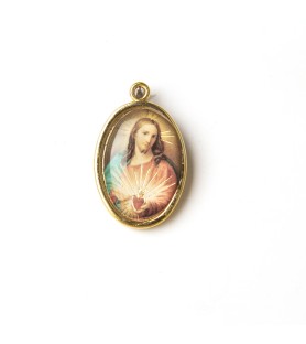 Medaglia ovale dorata del Sacro Cuore di Gesù