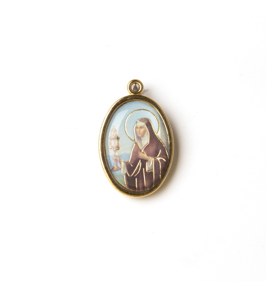 Medaglia ovale dorata di Santa Chiara